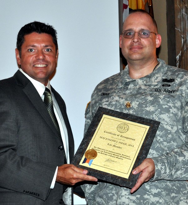 In September, Grimes (r) presents a Lifetime Membership Award to Maj. Joseph Smail, USA.